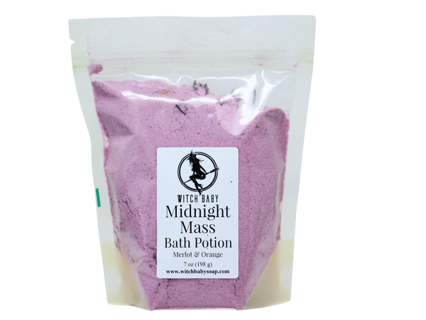 Purple bath potion in a clear bag with a label on a white background