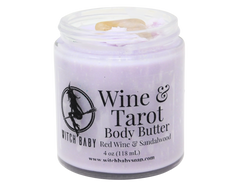 purple body butter packaged in a glass jar with citrine on top and a clear label that reads: wine & tarot body butter, red wine & sandalwood