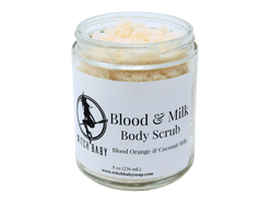 Photo of Blood and Milk body scrub - off white scrub in glass jar with white label that reads: Blood & Milk Body Scrub. Blood Orange & Coconut Milk. 8 oz (236 mL) www.witchbabysoap.com