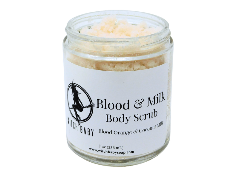 Photo of Blood and Milk body scrub - off white scrub in glass jar with white label that reads: Blood & Milk Body Scrub. Blood Orange & Coconut Milk. 8 oz (236 mL) www.witchbabysoap.com